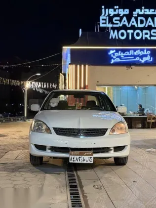 ميتسوبيشي لانسر 2013 أبيض مستعملة للبيع