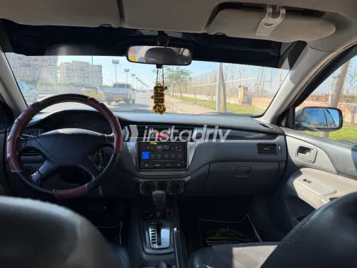 ميتسوبيشي لانسر بومة 2005 أبيض مستعملة للبيع - 6