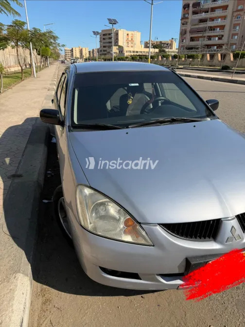 ميتسوبيشي لانسر بومة 2005 أبيض مستعملة للبيع - 8