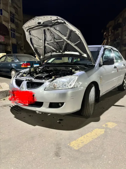 ميتسوبيشي لانسر بومة 2005 أبيض مستعملة للبيع - 9