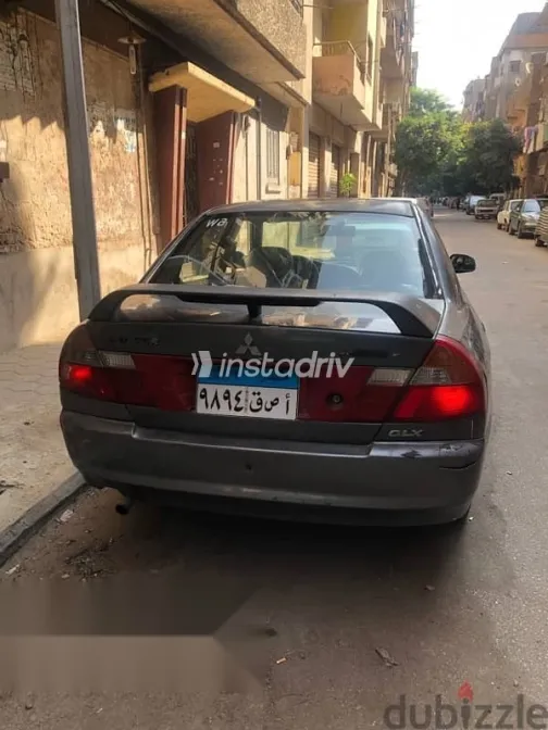ميتسوبيشي لانسر 1999 فضي مستعملة للبيع - 1