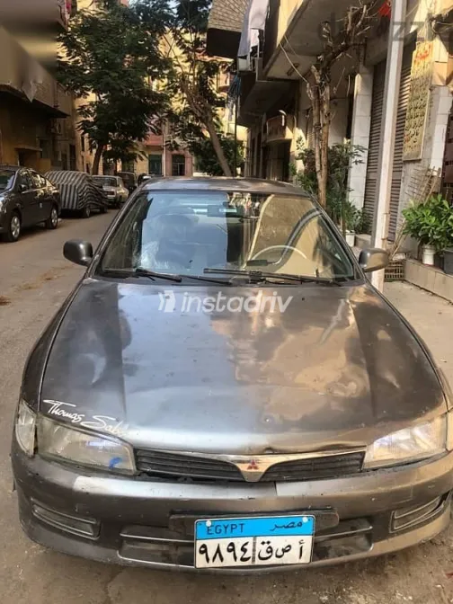 ميتسوبيشي لانسر 1999 فضي مستعملة للبيع - 2