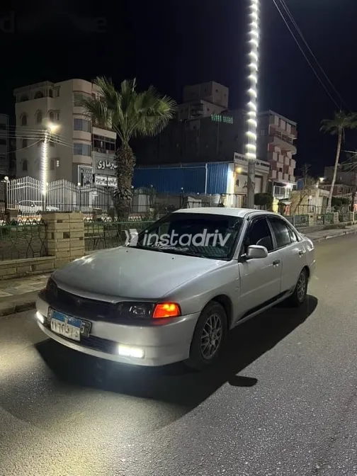 ميتسوبيشي ميراج 1999 رمادي مستعملة للبيع - 3