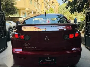 ميتسوبيشي لانسر 2016 أحمر مستعملة للبيع