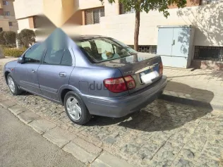 نيسان صنى 2003 أبيض مستعملة للبيع