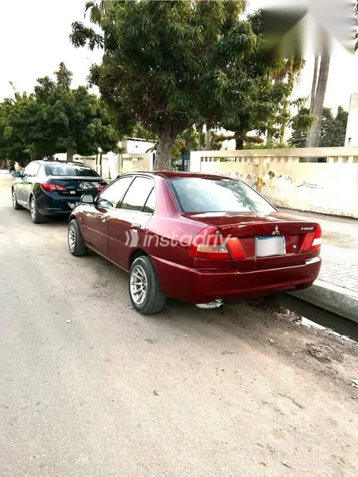 ميتسوبيشي لانسر 1996 أحمر مستعملة للبيع - 3