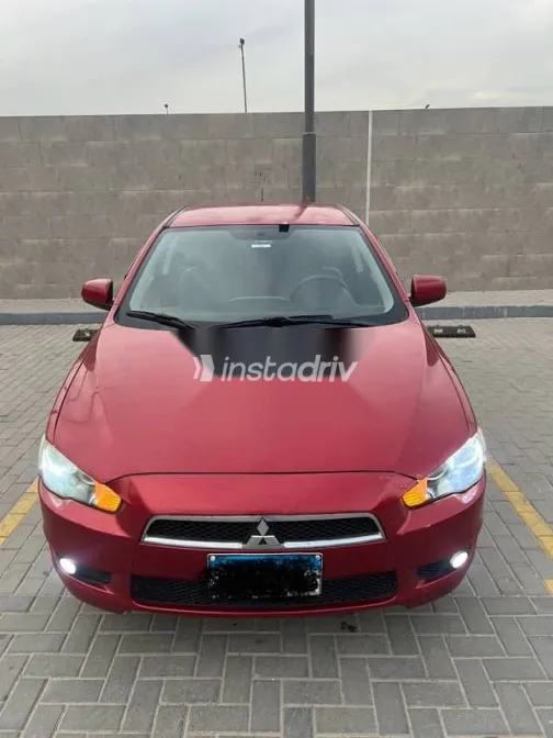 ميتسوبيشي لانسر 2009 أحمر مستعملة للبيع - 1