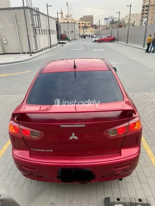 ميتسوبيشي لانسر 2009 أحمر مستعملة للبيع - 2