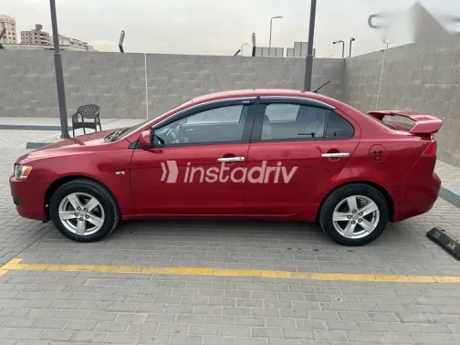 ميتسوبيشي لانسر 2009 أحمر مستعملة للبيع - 3
