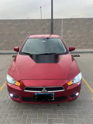 ميتسوبيشي لانسر 2009 أحمر مستعملة للبيع