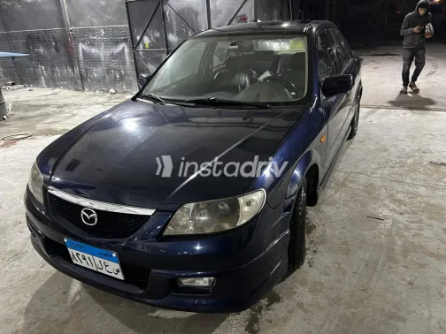 مازدا 323 2000 أبيض مستعملة للبيع - 1