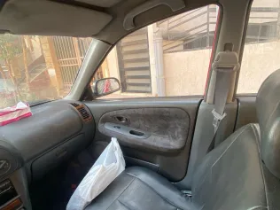 ميتسوبيشي لانسر 1998 أبيض مستعملة للبيع