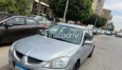 ميتسوبيشي لانسر 2005 أبيض مستعملة للبيع - 1