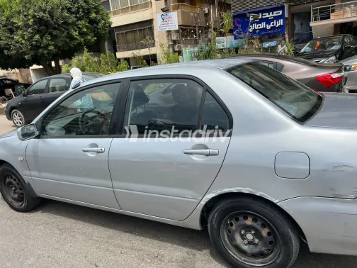 ميتسوبيشي لانسر 2005 أبيض مستعملة للبيع - 2