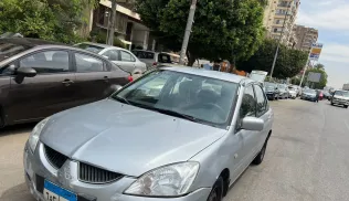 ميتسوبيشي لانسر 2005 أبيض مستعملة للبيع