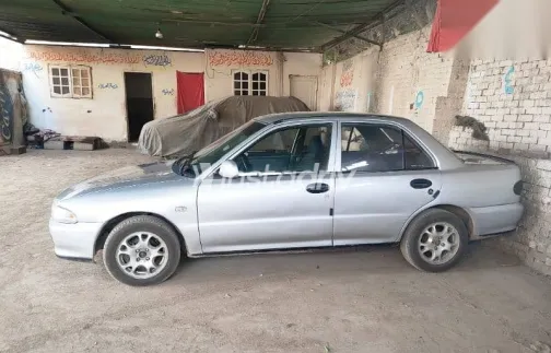 ميتسوبيشي لانسر 1992 فضي مستعملة للبيع - 9