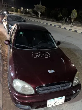 شيفروليه لانوس 2014 أحمر غامق مستعملة للبيع