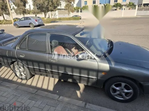 ميتسوبيشي لانسر 1994 رمادي مستعملة للبيع - 2