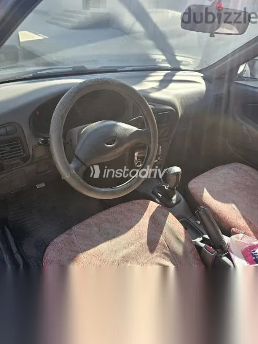 ميتسوبيشي لانسر 1994 رمادي مستعملة للبيع - 3