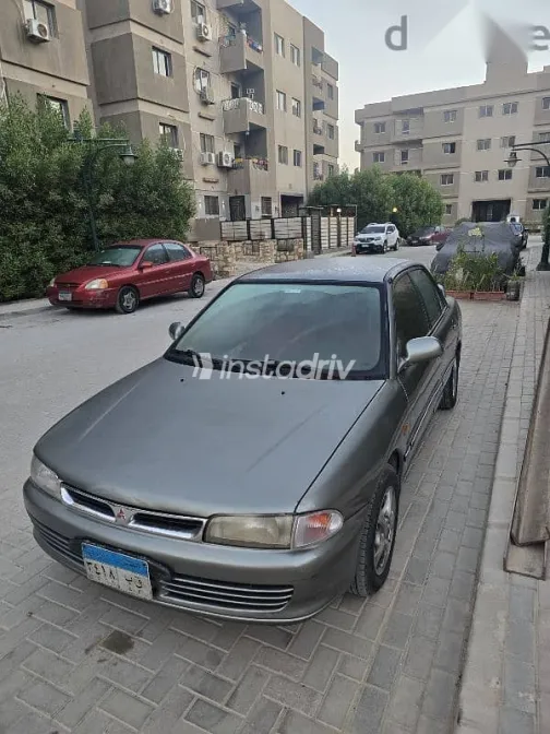 ميتسوبيشي لانسر 1994 رمادي مستعملة للبيع - 6