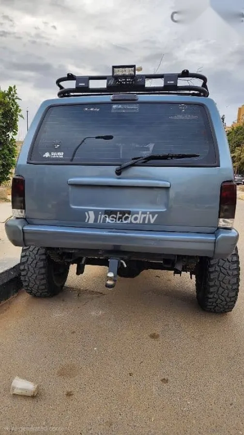 جيب شيروكي 1998 أزرق غامق مستعملة للبيع - 2