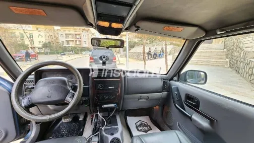 جيب شيروكي 1998 أزرق غامق مستعملة للبيع - 4