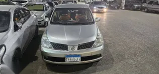 نيسان تيدا 2006 فضي مستعملة للبيع