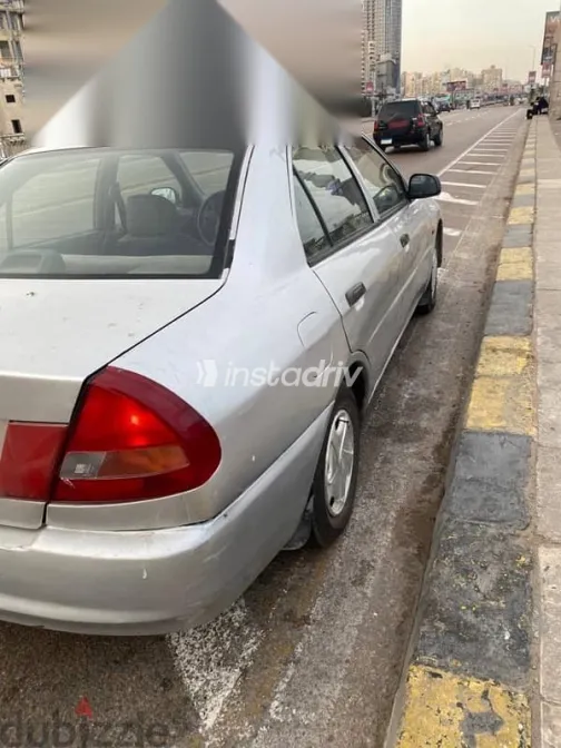 ميتسوبيشي لانسر 1998 فضي مستعملة للبيع - 6