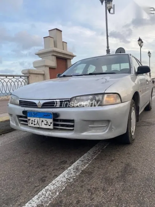 ميتسوبيشي لانسر 1998 فضي مستعملة للبيع - 8