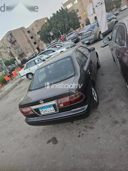 نيسان صنى 1999 رمادي مستعملة للبيع - 3