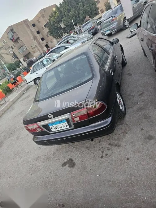 نيسان صنى 1999 رمادي مستعملة للبيع - 4