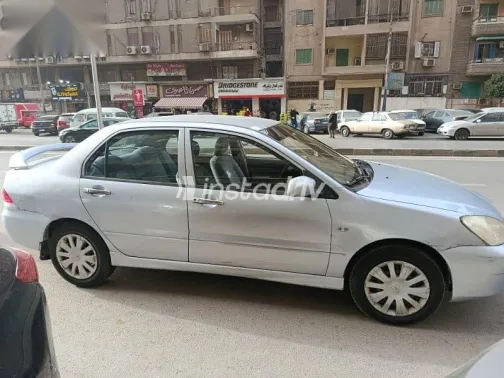 ميتسوبيشي لانسر 2013 فضي مستعملة للبيع - 2