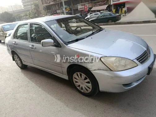 ميتسوبيشي لانسر 2013 فضي مستعملة للبيع - 7