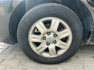 كيا كارينز 2010 أبيض مستعملة للبيع