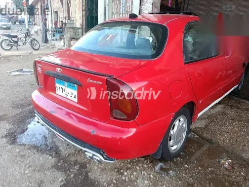 دايو لانوس 2004 أحمر مستعملة للبيع - 1