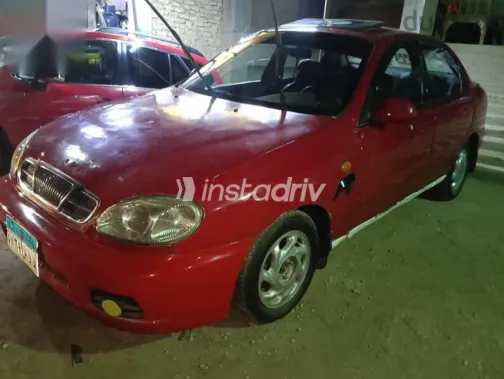 دايو لانوس 2004 أحمر مستعملة للبيع - 2