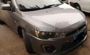 ميتسوبيشي لانسر اى اكس شارك 2018 فضي مستعملة للبيع