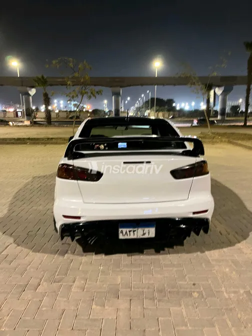 ميتسوبيشي لانسر 2014 أبيض مستعملة للبيع - 1