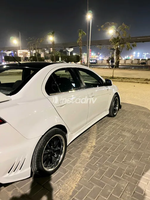 ميتسوبيشي لانسر 2014 أبيض مستعملة للبيع - 7