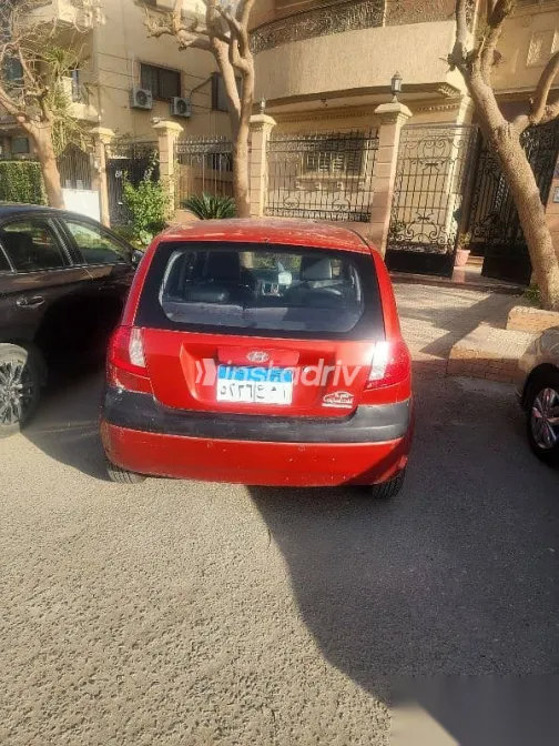 هيونداي جيتز 2010 أحمر مستعملة للبيع - 4