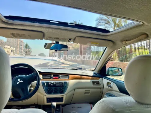 ميتسوبيشي لانسر 2007 أبيض مستعملة للبيع - 9