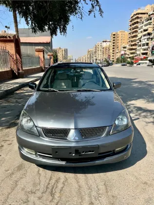 ميتسوبيشي لانسر 2007 أبيض مستعملة للبيع