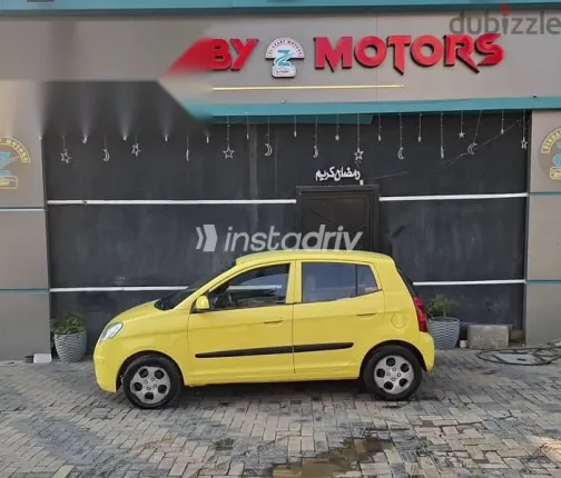 كيا بيكانتو 2010 أصفر مستعملة للبيع - 4