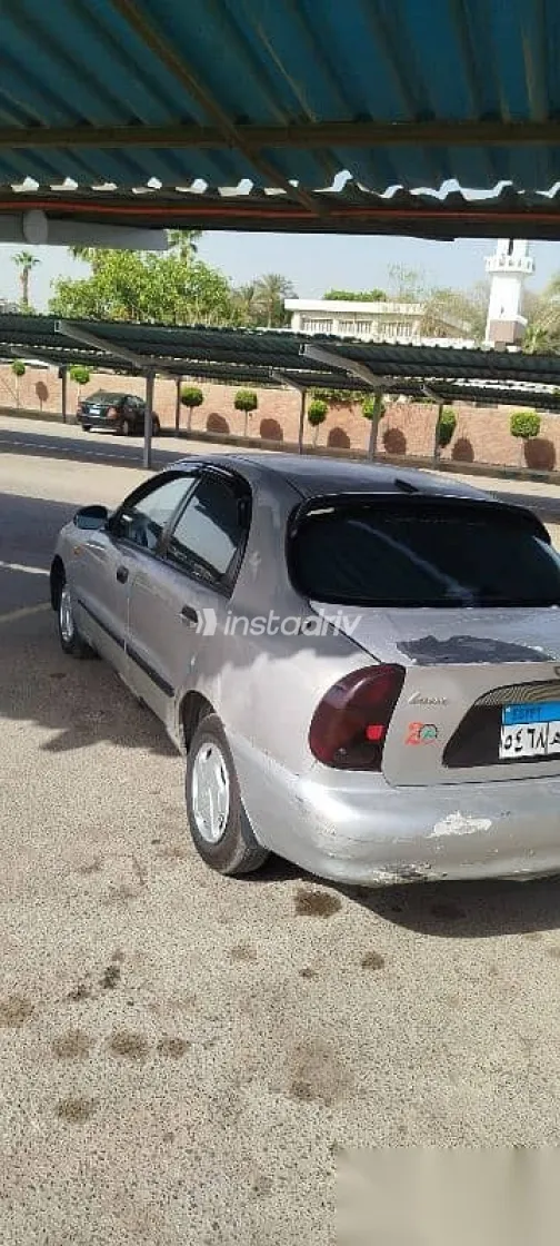 دايو لانوس 2004 فضي مستعملة للبيع - 1