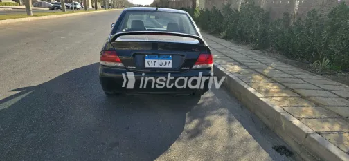 ميتسوبيشي لانسر 2009 أبيض مستعملة للبيع - 1