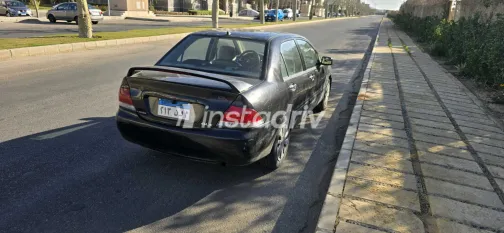 ميتسوبيشي لانسر 2009 أبيض مستعملة للبيع - 3