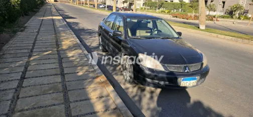 ميتسوبيشي لانسر 2009 أبيض مستعملة للبيع - 7