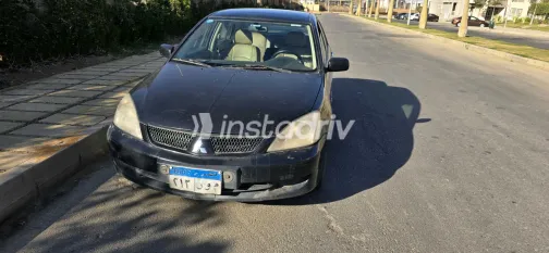 ميتسوبيشي لانسر 2009 أبيض مستعملة للبيع - 8