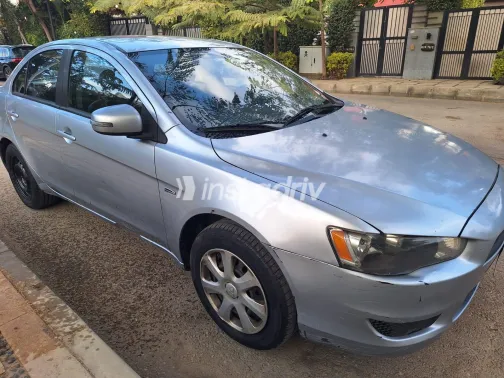 ميتسوبيشي لانسر 2015 أبيض مستعملة للبيع - 2