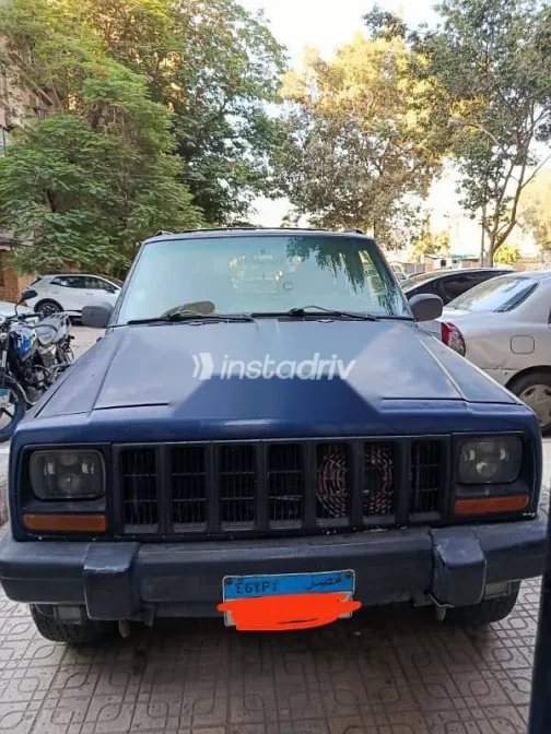 جيب شيروكي 1999 أزرق غامق مستعملة للبيع - 1